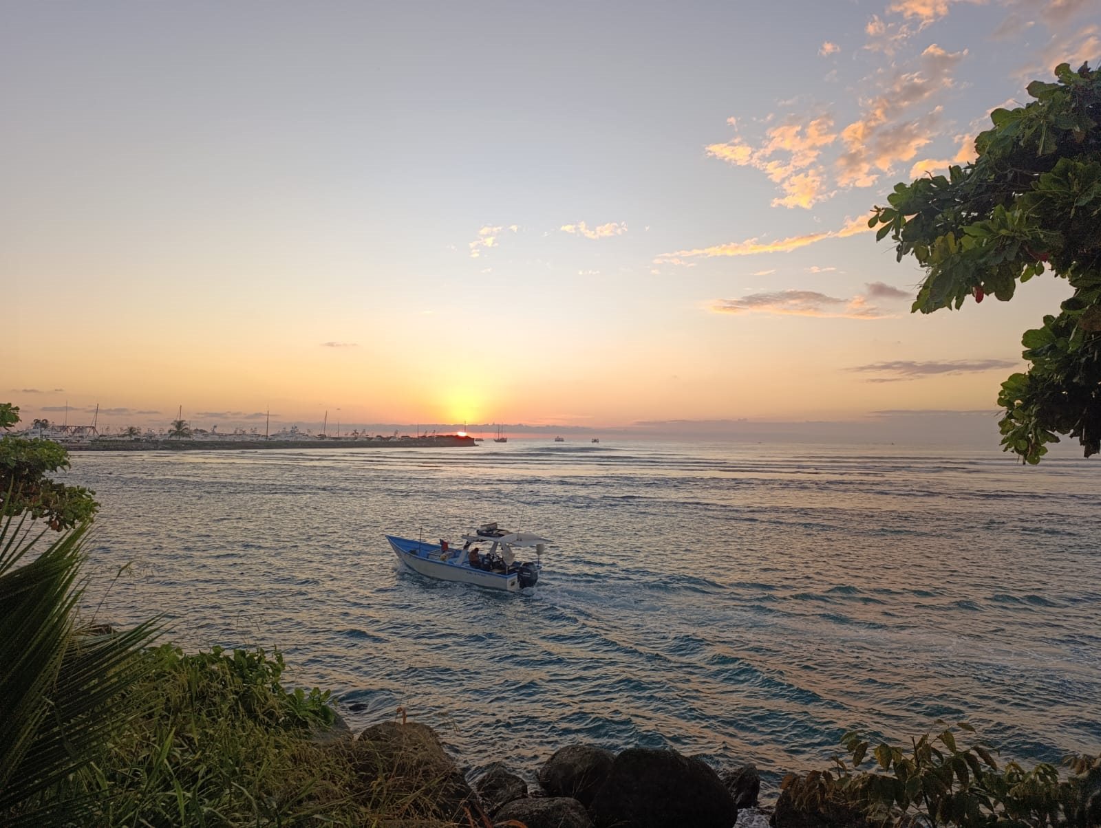 Small boat at sunset near Quepos marina